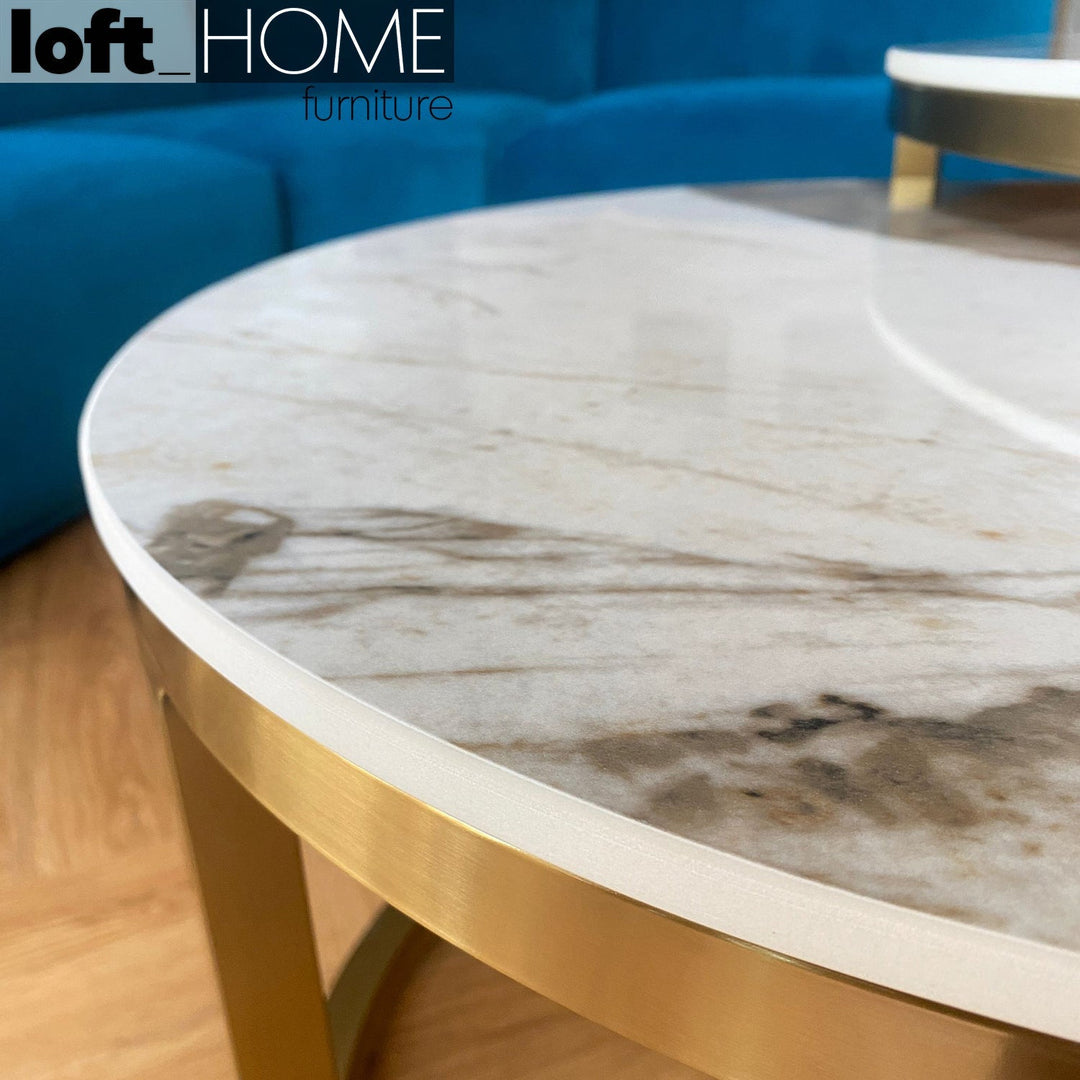 Modern sintered stone coffee table gold in details.