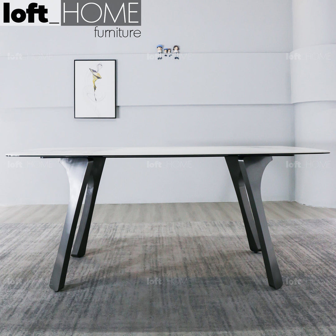 Modern sintered stone dining table fly grey with context.
