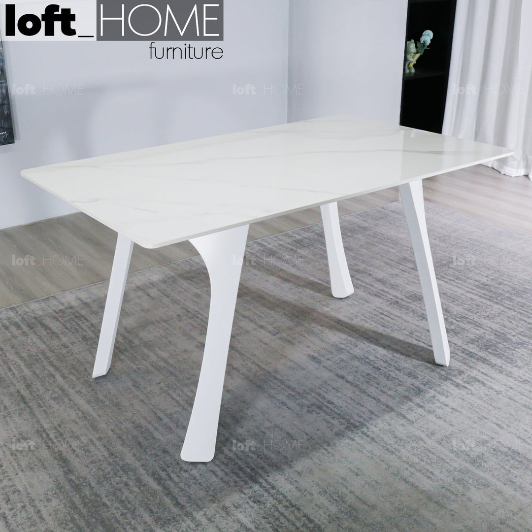 Modern sintered stone dining table fly white with context.