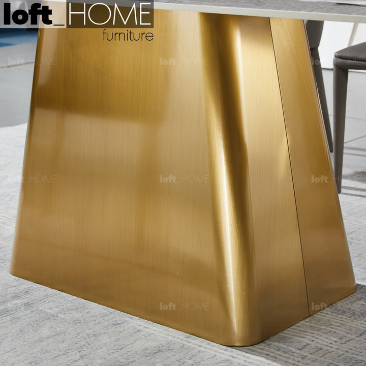 Modern sintered stone dining table haku gold in real life style.