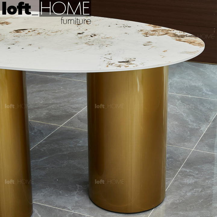 Modern sintered stone dining table lagos gold with context.