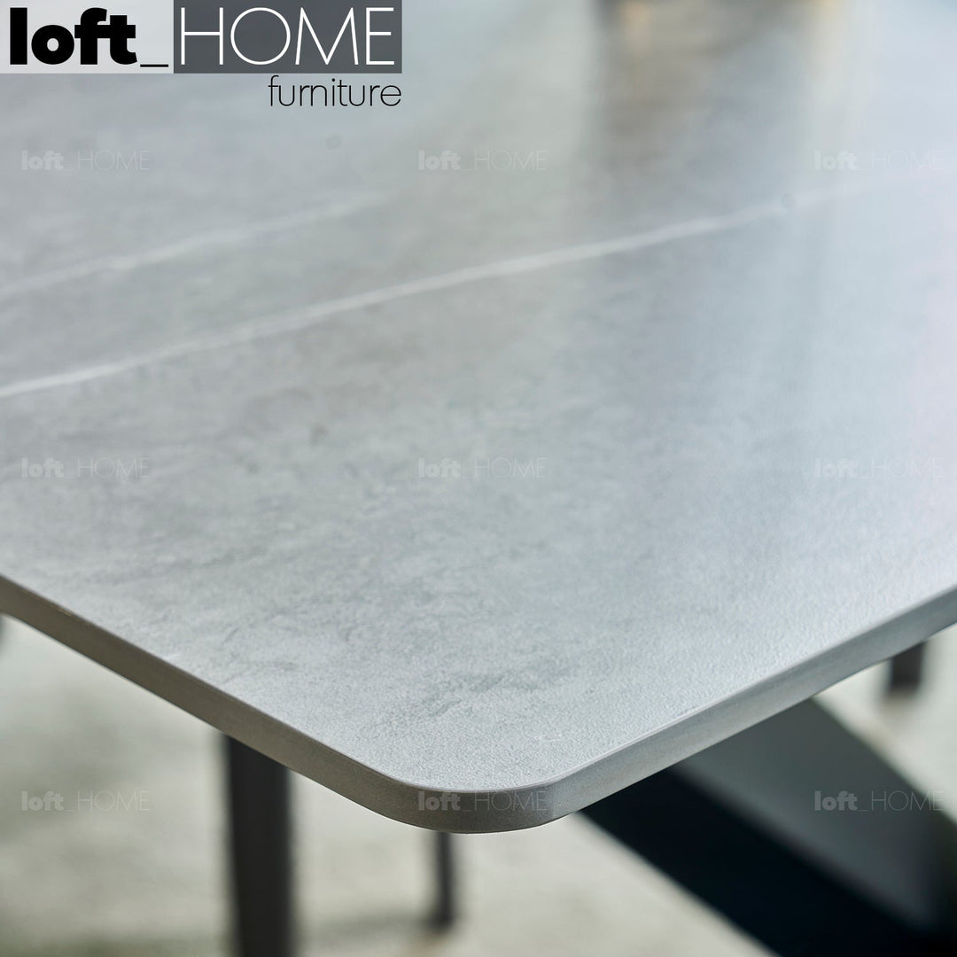 Modern sintered stone dining table spider black with context.