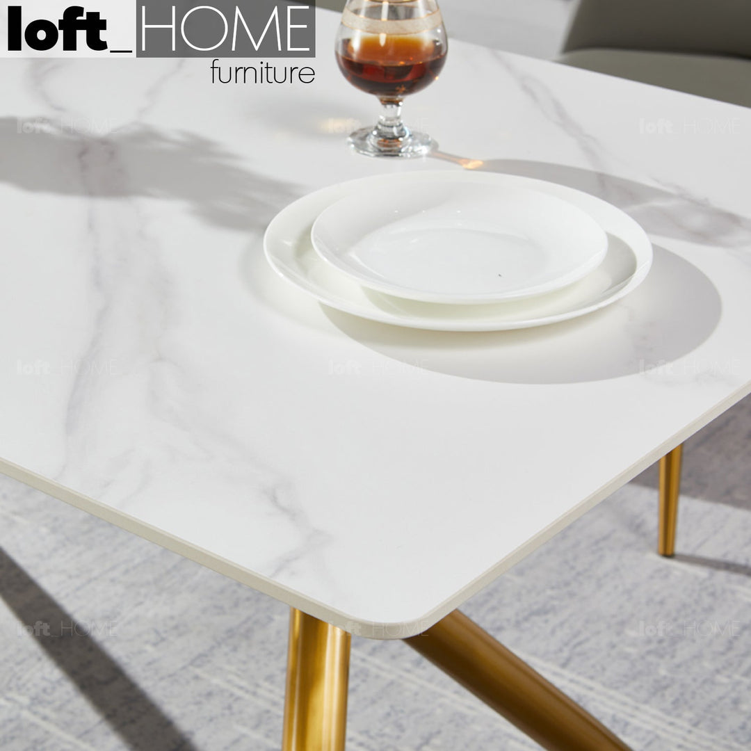 Modern sintered stone dining table spider gold in close up details.