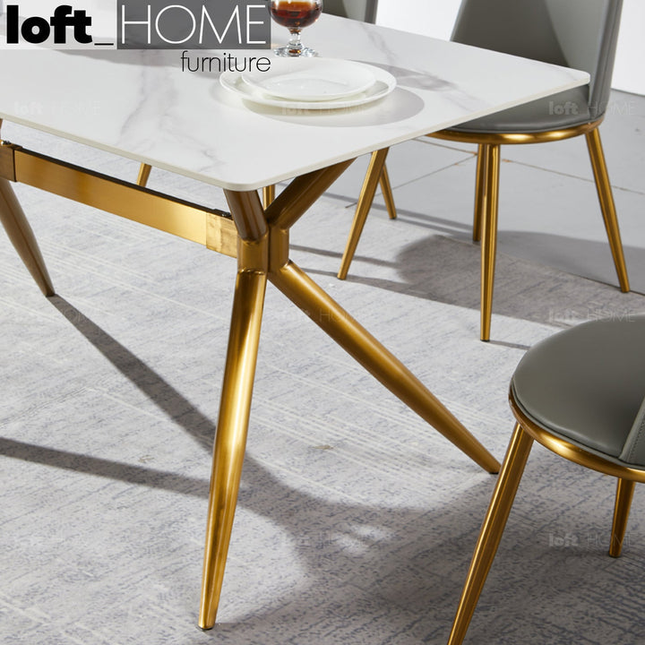 Modern sintered stone dining table spider gold in real life style.