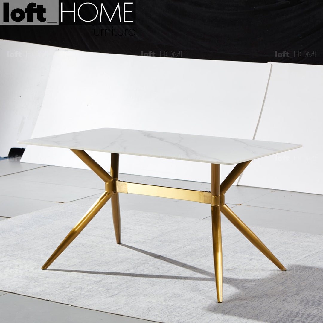 Modern sintered stone dining table spider gold in details.