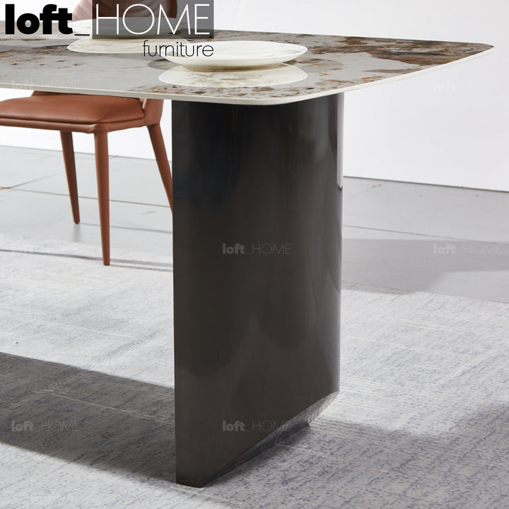 Modern sintered stone dining table wedge black with context.