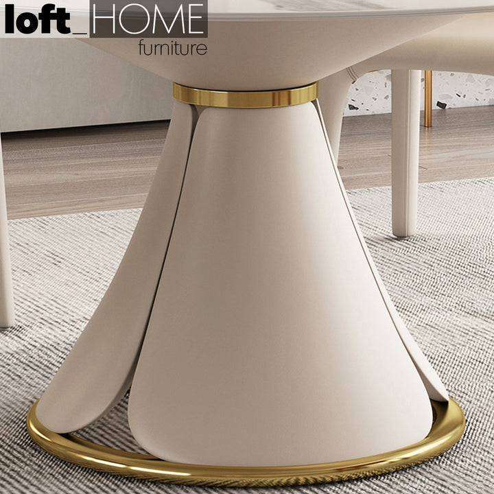 Modern sintered stone round dining table petal with context.