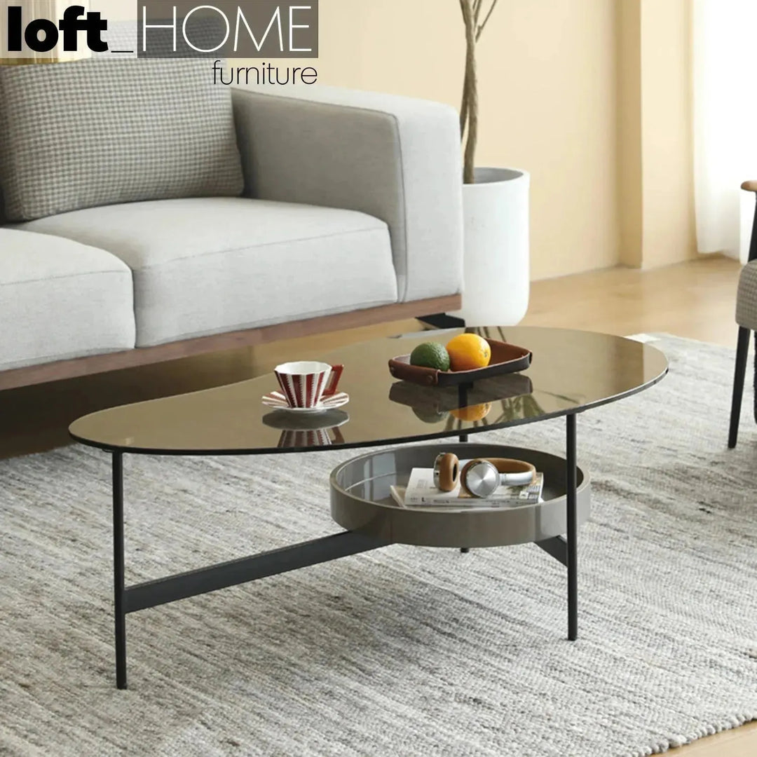 Modern tempered glass coffee table gioia with context.