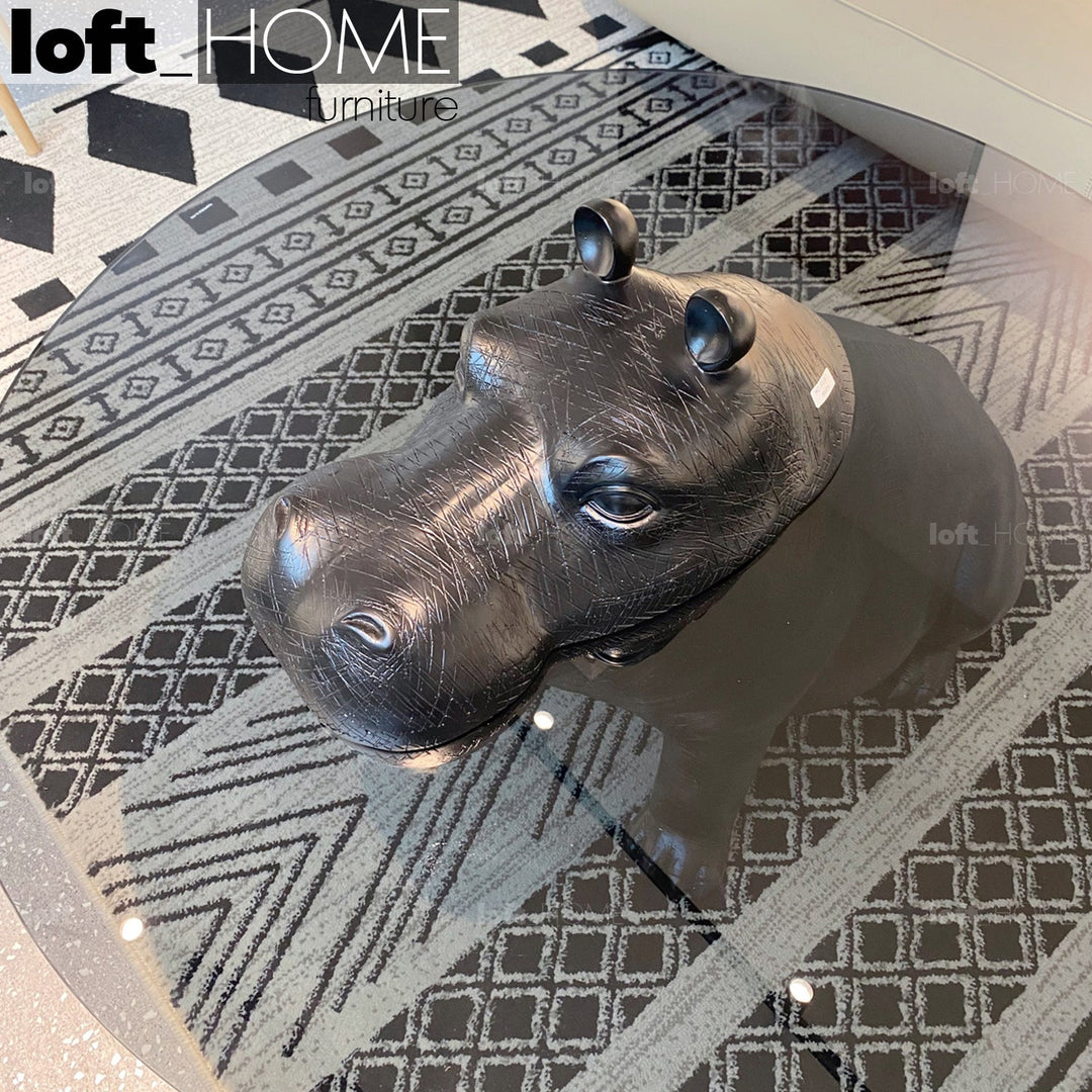 Modern tempered glass coffee table hippo in close up details.