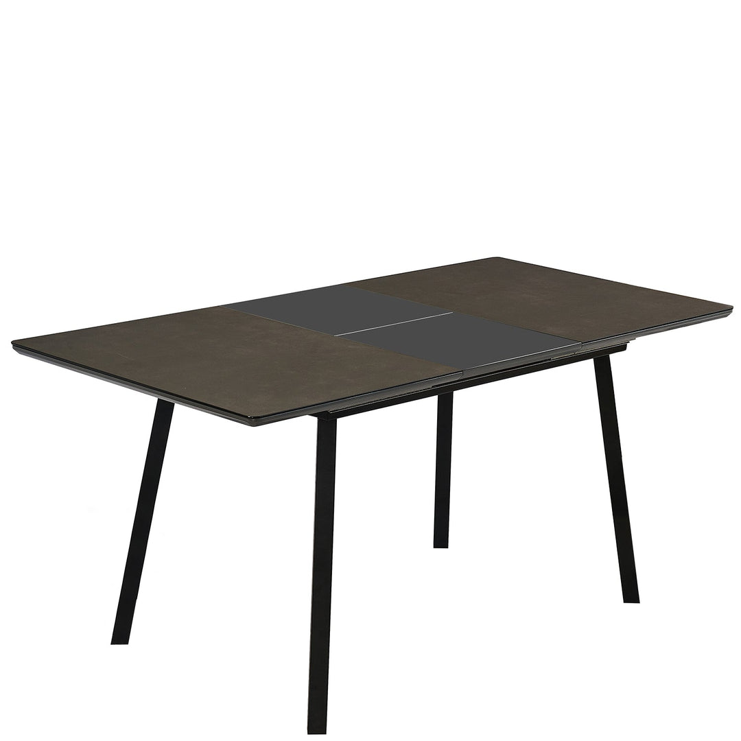 Modern tempered glass extendable dining table glaze in white background.
