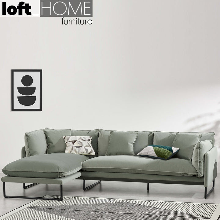 Modern velvet l shape sectional sofa malini 2+l in panoramic view.