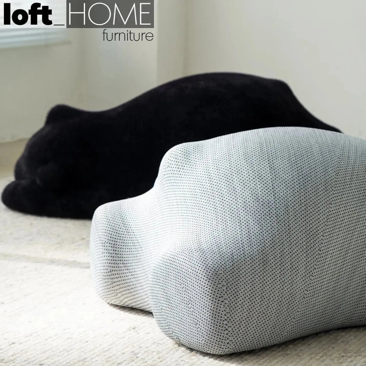 Bauhaus velvet ottoman resting bear black in real life style.