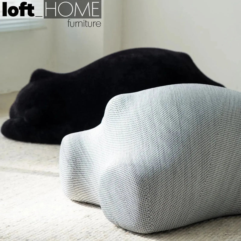 Bauhaus velvet ottoman resting bear black in real life style.