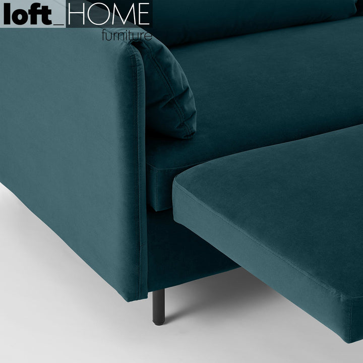 Modern velvet sofa bed hitomi steel blue in close up details.