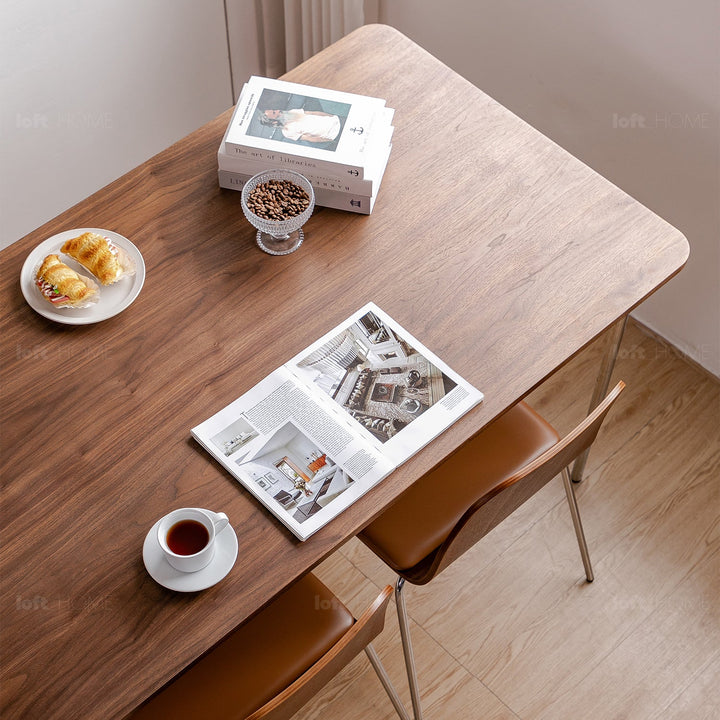 Modern wood dining table walnut halden in still life.