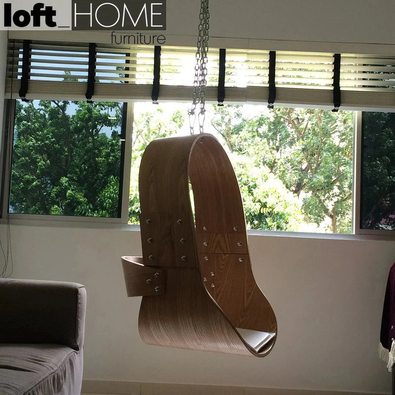 Scandinavian wood hanging chair 1 seater sofa plywood in real life style.