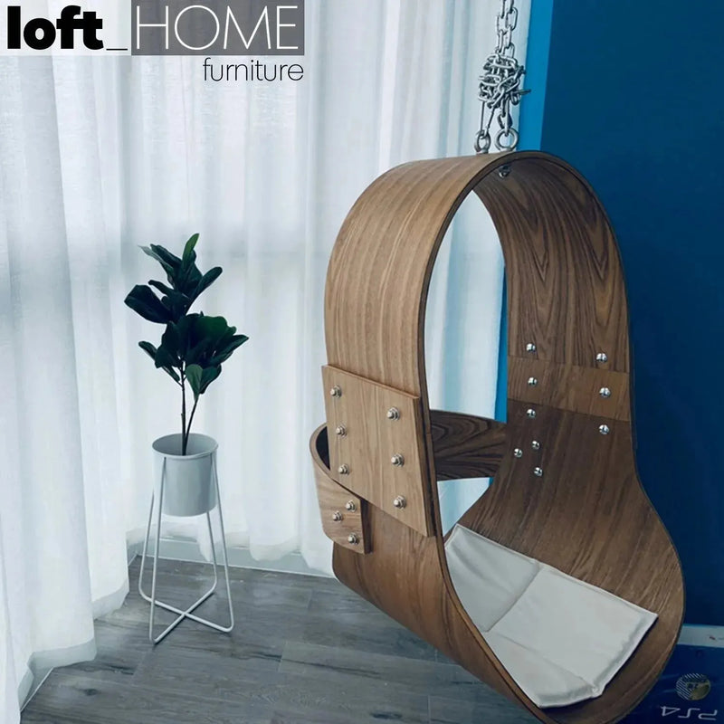 Scandinavian wood hanging chair 1 seater sofa plywood in panoramic view.