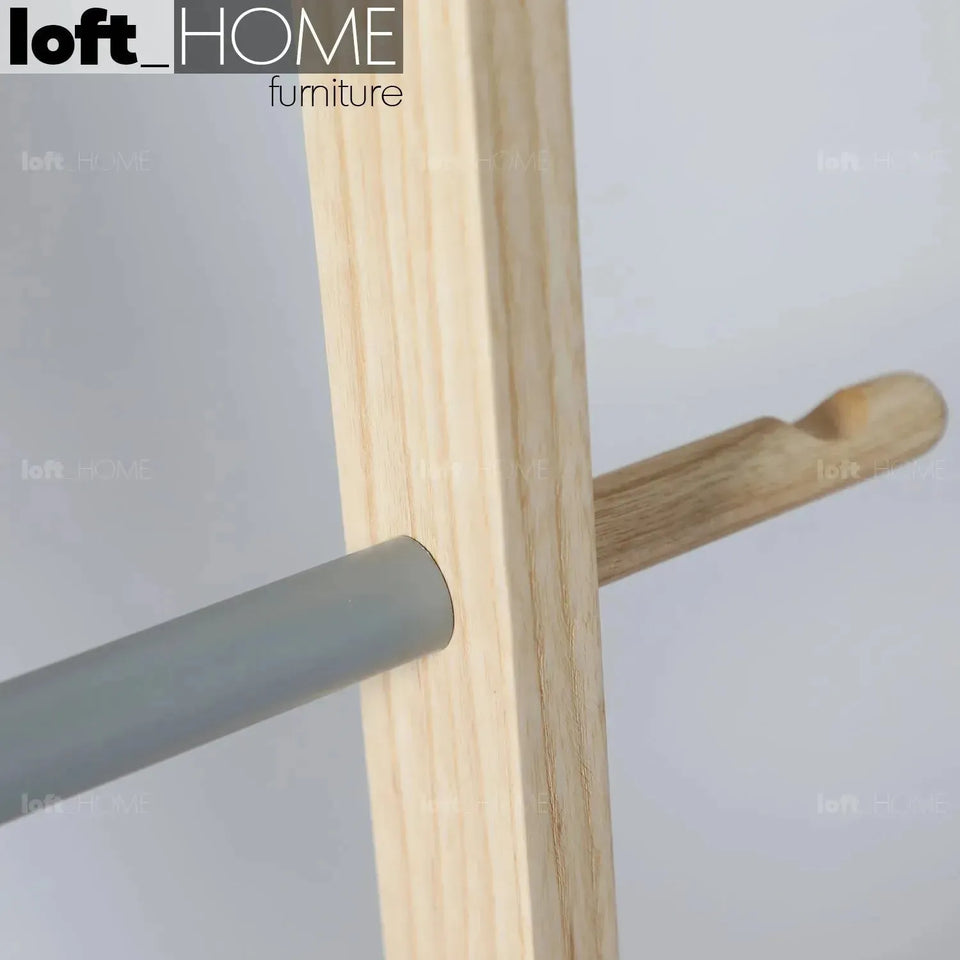 Modern wood tower ladder cloth hanger gonn in still life.
