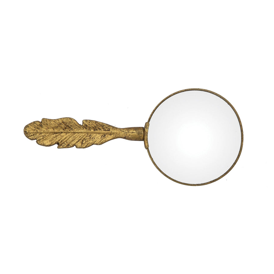 Pewter magnifying glass with feather shaped handle decor in white background.