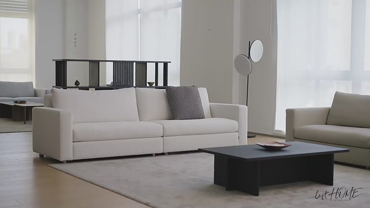 Minimalist fabric 4 seater sofa white with context.