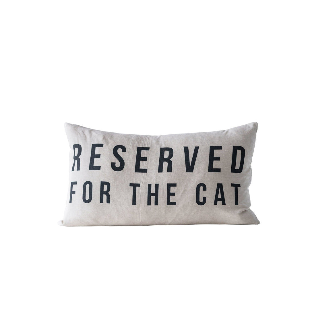 "reserved for the cat" cotton pillow in white background.