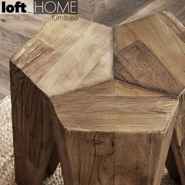 Rustic elm wood stool tripod in real life style.