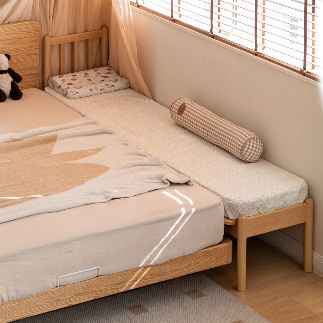 Scandinavian beech wood height adjustable kids sidecar bed with mattress anchor with context.