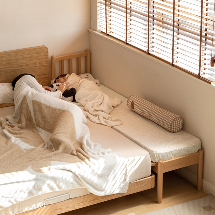 Scandinavian beech wood height adjustable kids sidecar bed with mattress anchor in details.