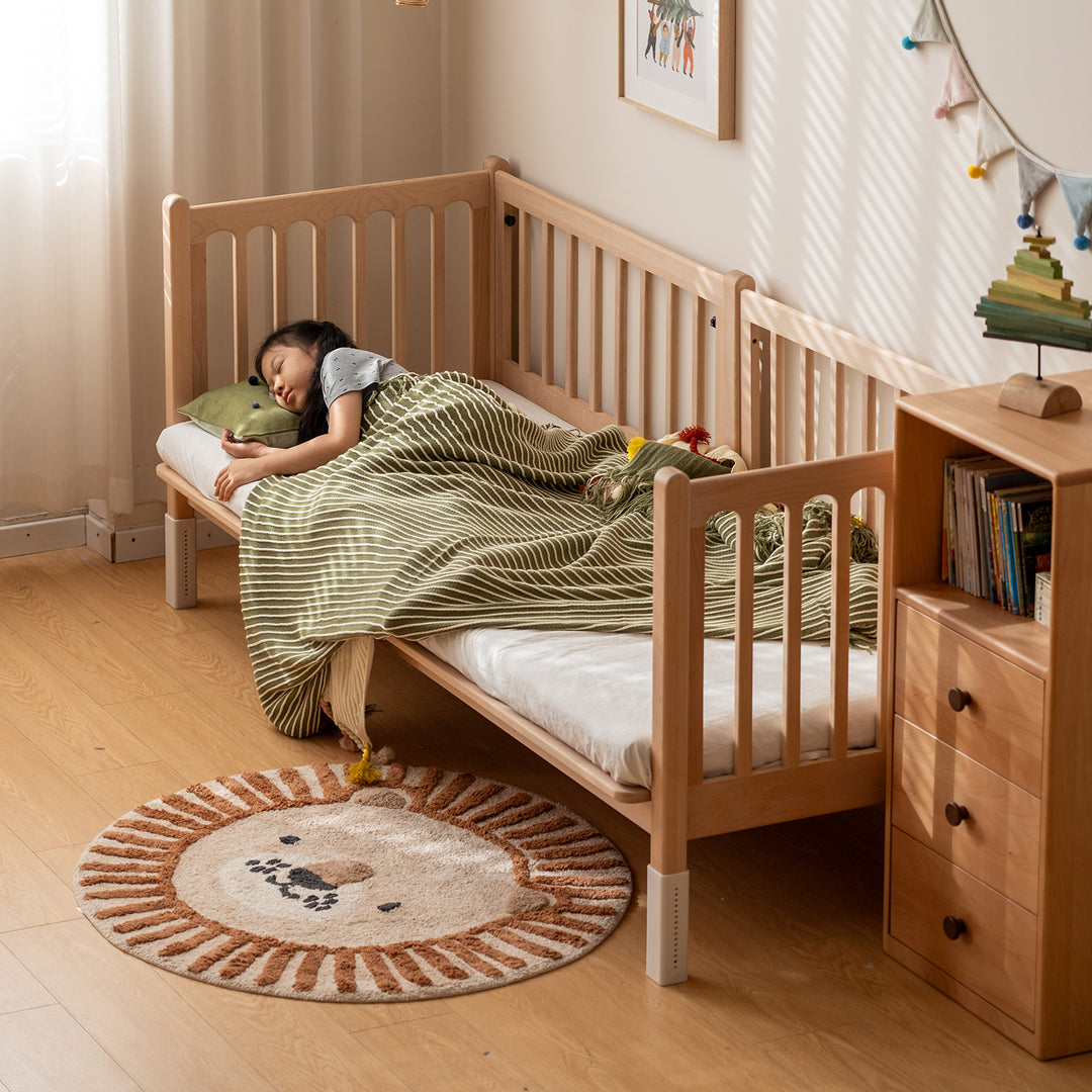 Scandinavian beech wood height adjustable kids sidecar bed with mattress set sova in close up details.