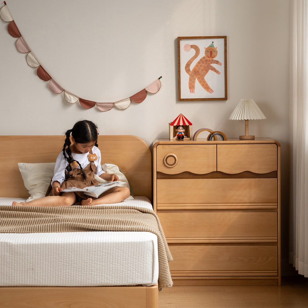 Scandinavian beech wood kids chest of drawers creamy with context.