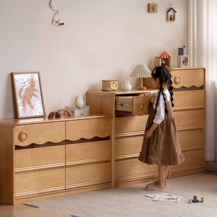 Scandinavian beech wood kids chest of drawers creamy in close up details.