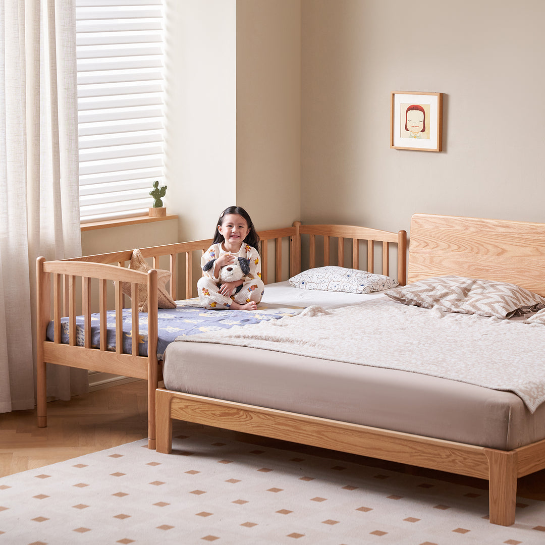 Scandinavian birch wood kids sidecar bed with mattress set myka in real life style.