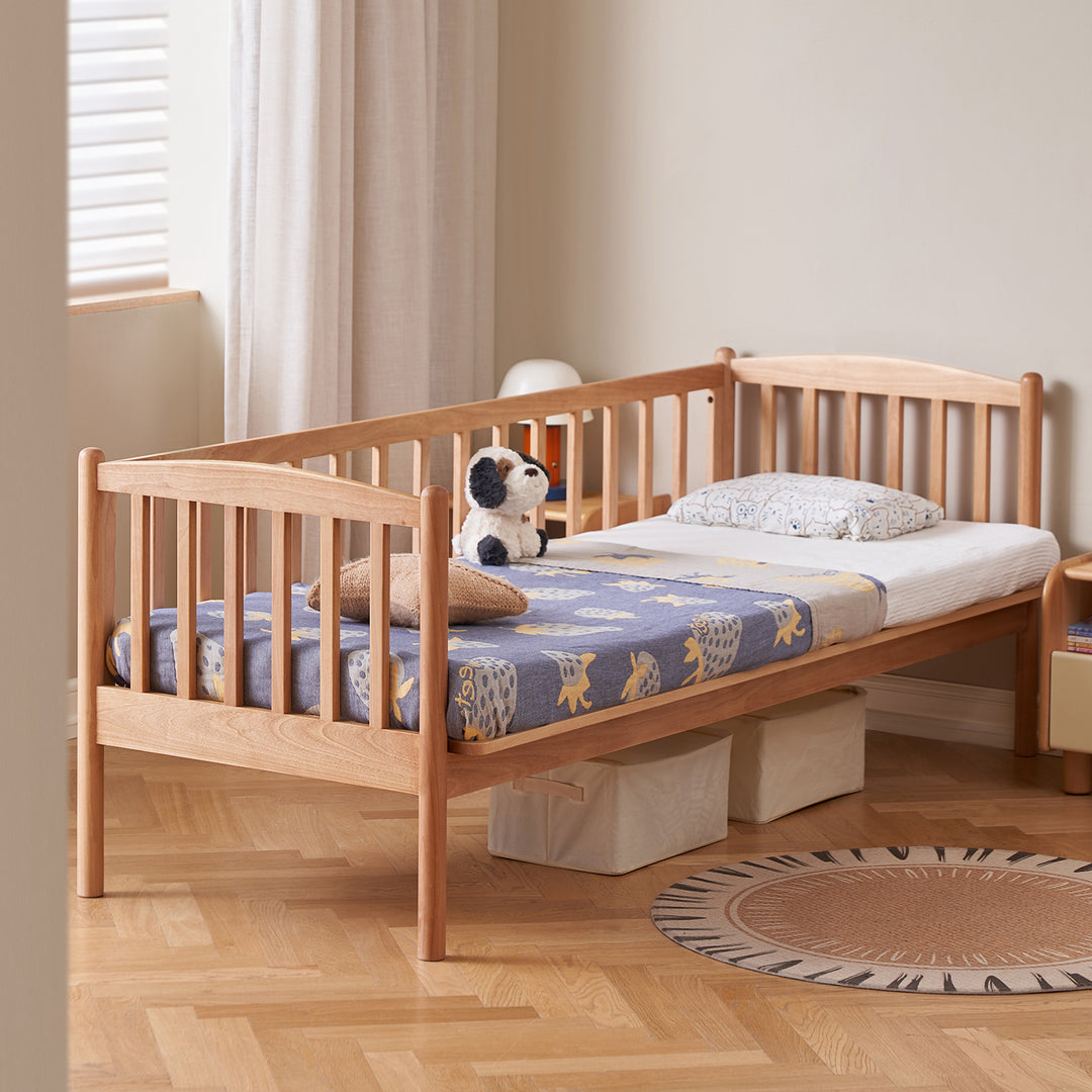 Scandinavian birch wood kids sidecar bed with mattress set myka in close up details.