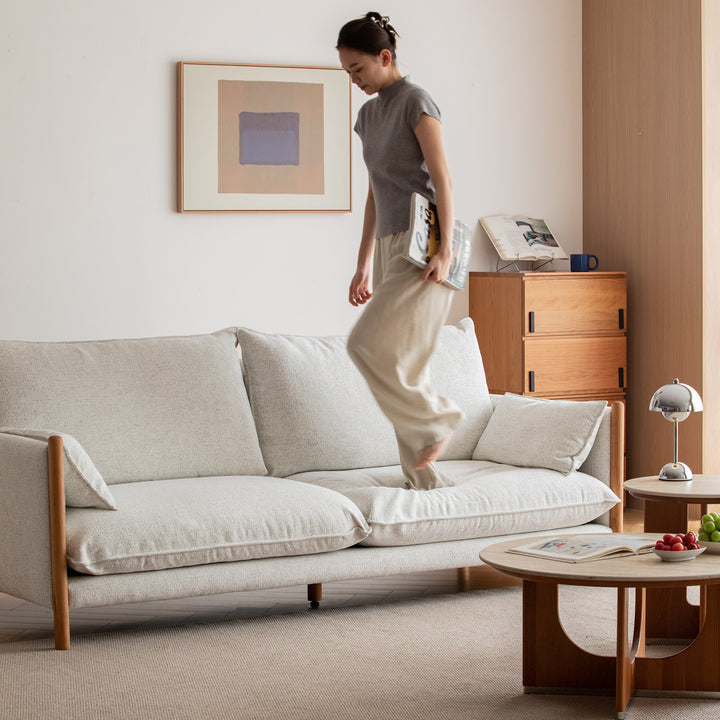 Scandinavian chenille velvet cherry wood 3 seater sofa sea salt in panoramic view.