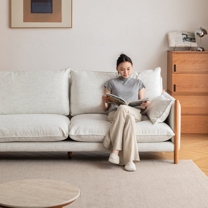 Scandinavian chenille velvet cherry wood 4 seater sofa sea salt in close up details.