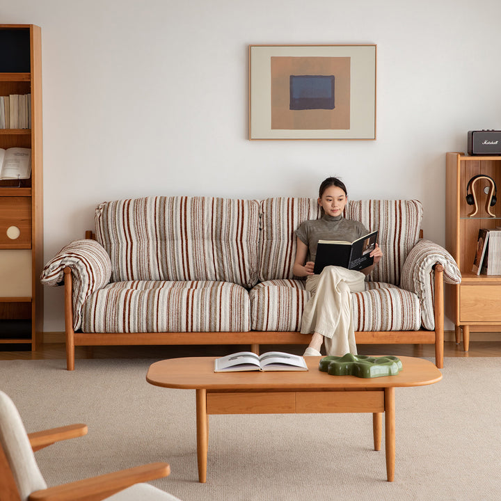 Scandinavian chenille velvet fabric cherry wood 3 seater sofa open backed in real life style.