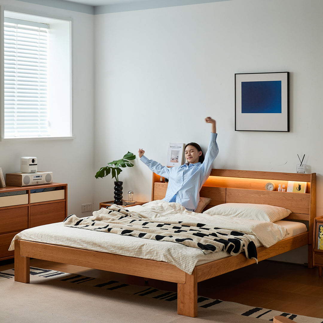 Scandinavian cherry wood bed accompany light with context.