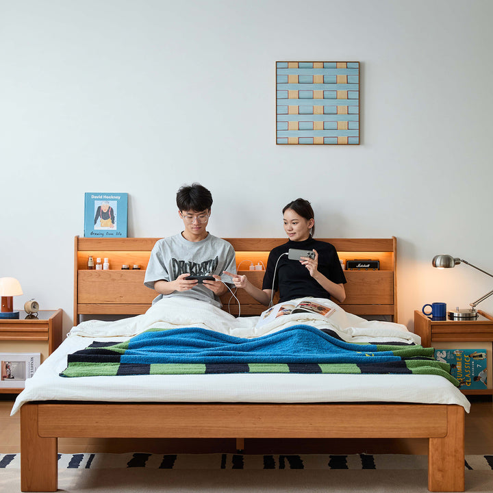 Scandinavian cherry wood bed accompany light in still life.