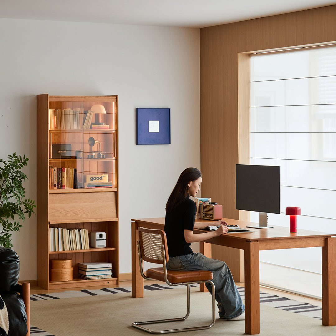 Scandinavian cherry wood bookshelf vista in panoramic view.