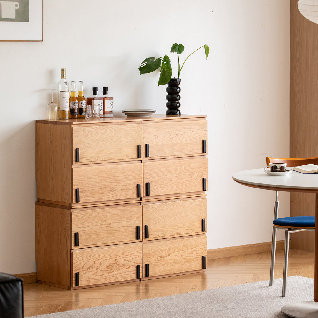 Scandinavian cherry wood cabinet dottie with context.