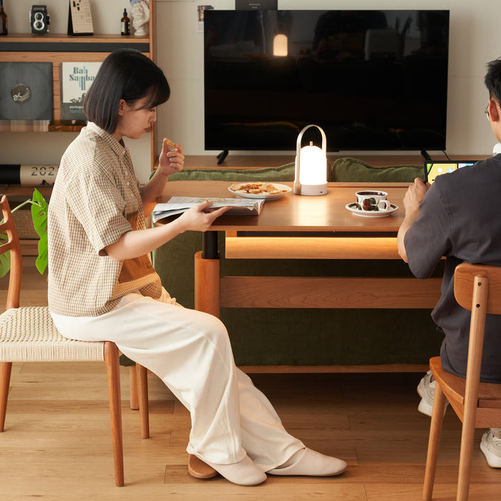 Scandinavian cherry wood electric height adjustable study table up with context.
