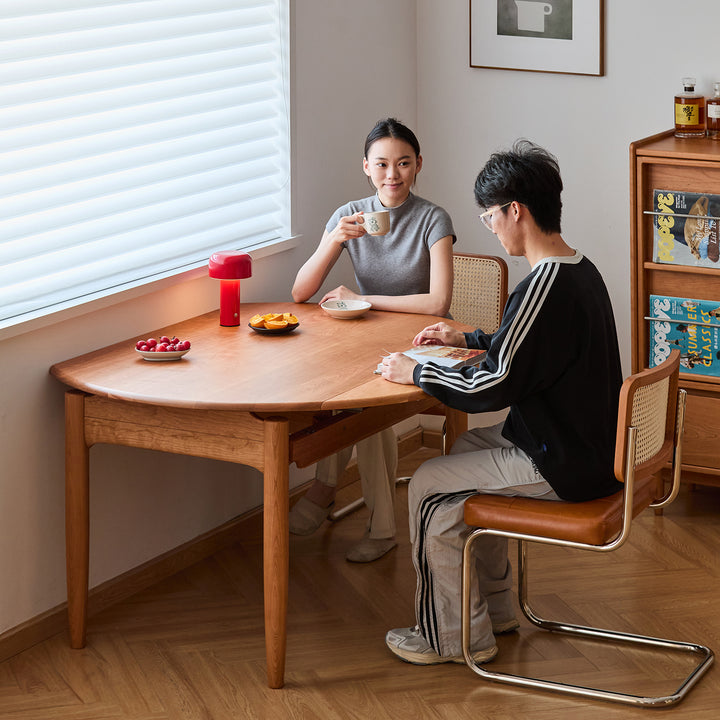 Scandinavian cherry wood extendable dining table minima in panoramic view.
