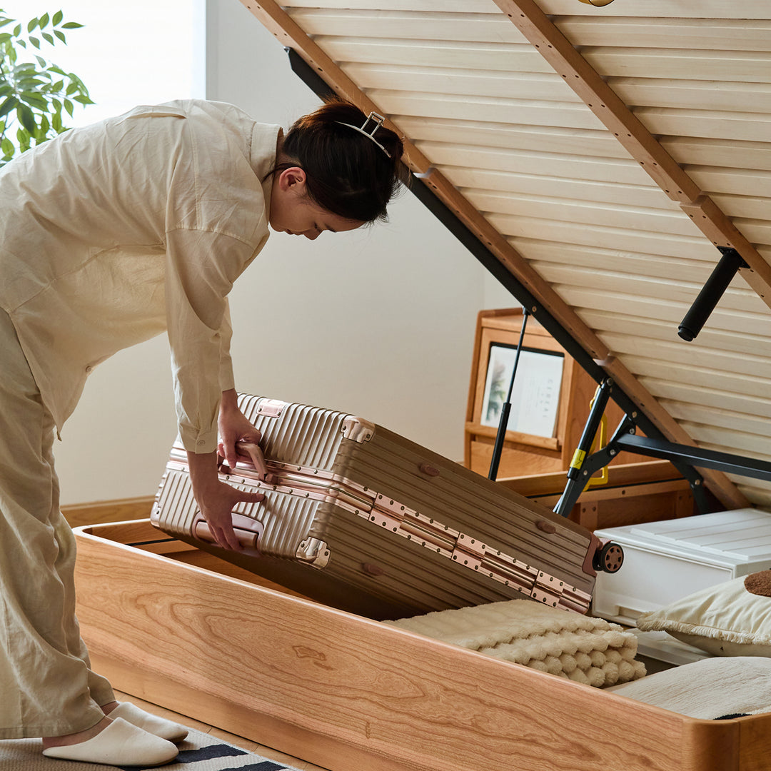 Scandinavian cherry wood lift-up storage bed square box with context.