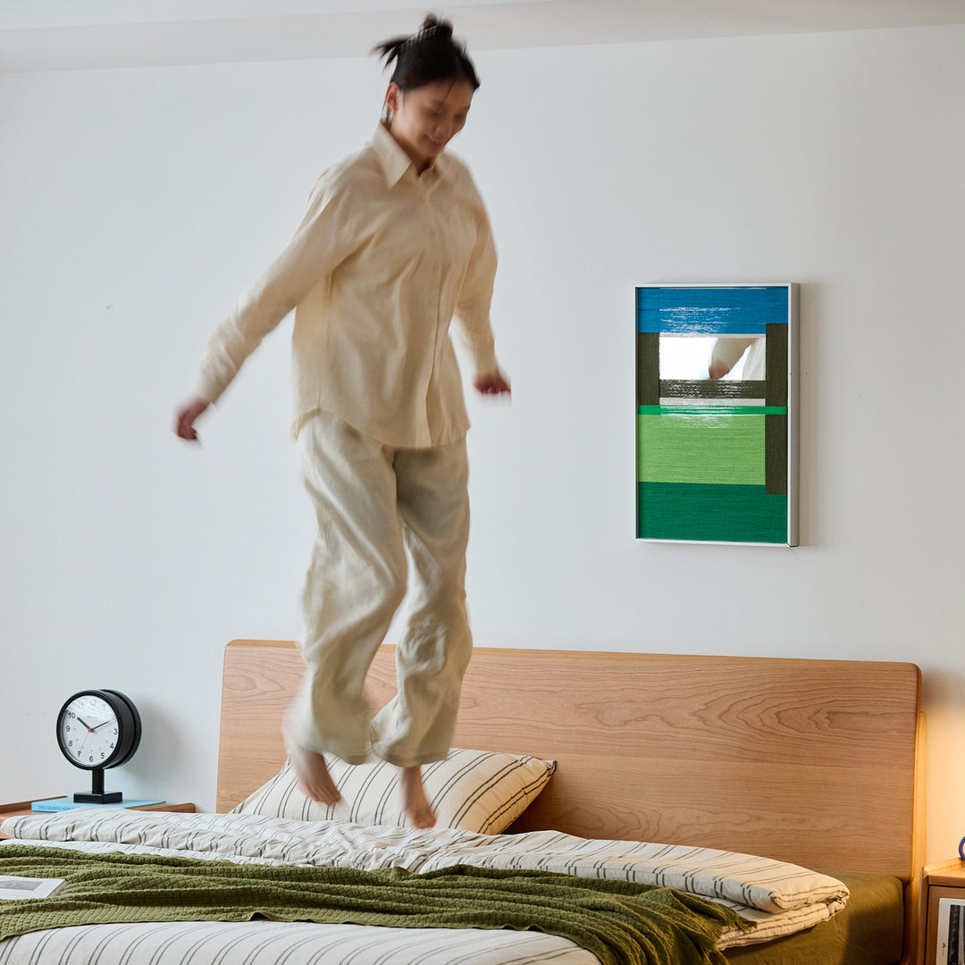 Scandinavian cherry wood lift-up storage bed square box in panoramic view.