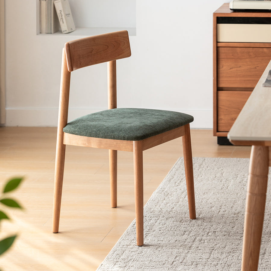 Scandinavian cherry wood mixed weave fabric dining chair green primary product view.