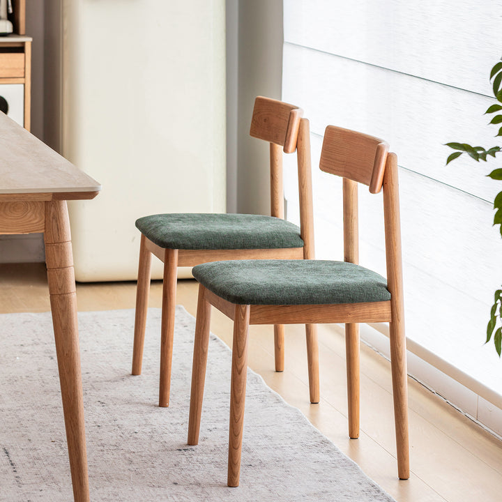 Scandinavian cherry wood mixed weave fabric dining chair green material variants.