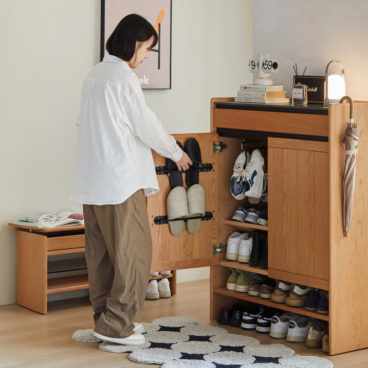 Scandinavian cherry wood modular shoe cabinet harbor in close up details.