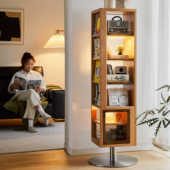 Scandinavian cherry wood revolving bookshelf with mirror twirl in still life.