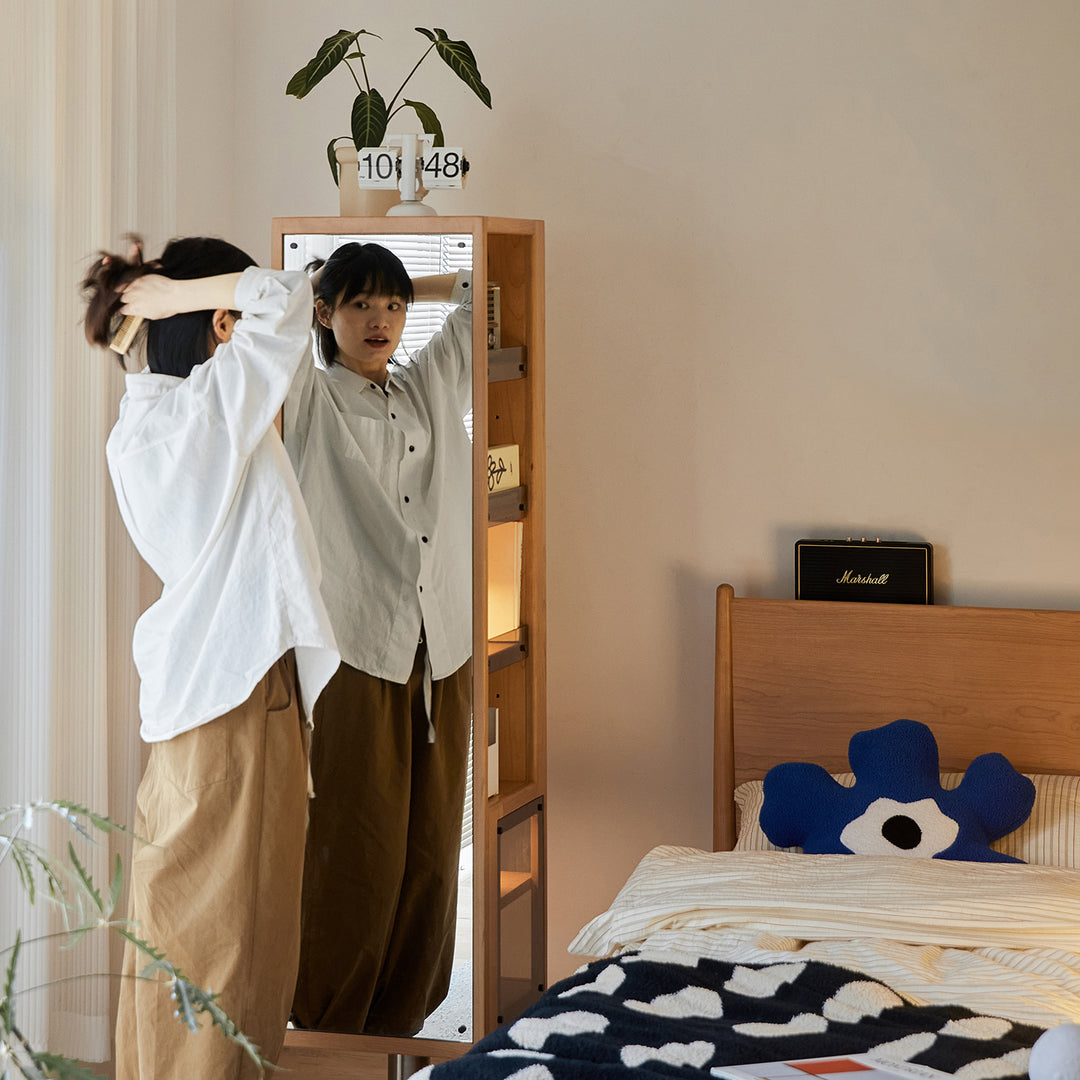 Scandinavian cherry wood revolving bookshelf with mirror twirl situational feels.