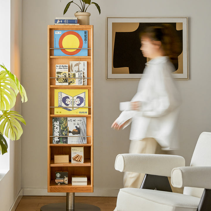 Scandinavian cherry wood revolving bookshelf with mirror twirl with context.